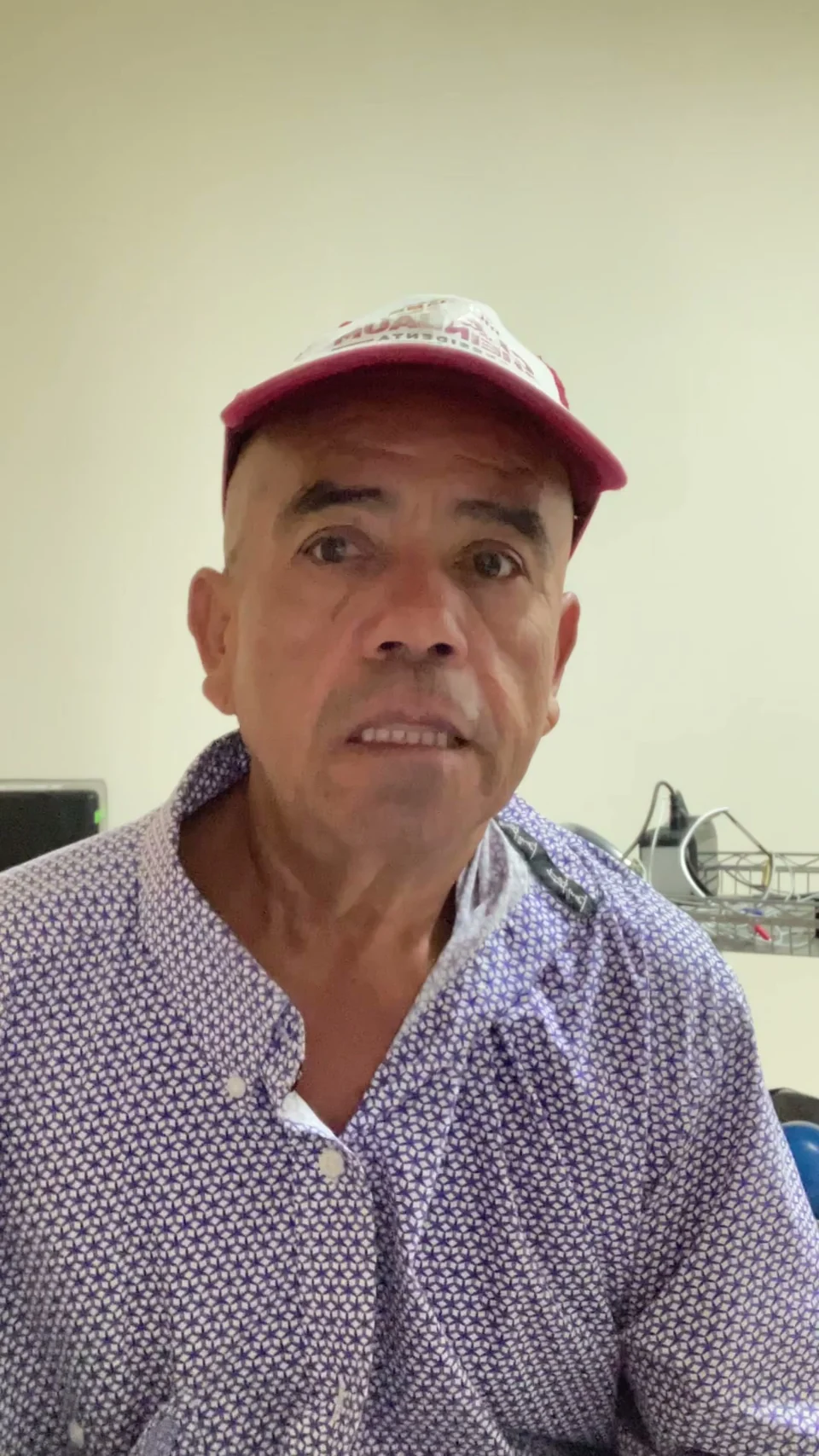 A man in a cap during a recorded conversation